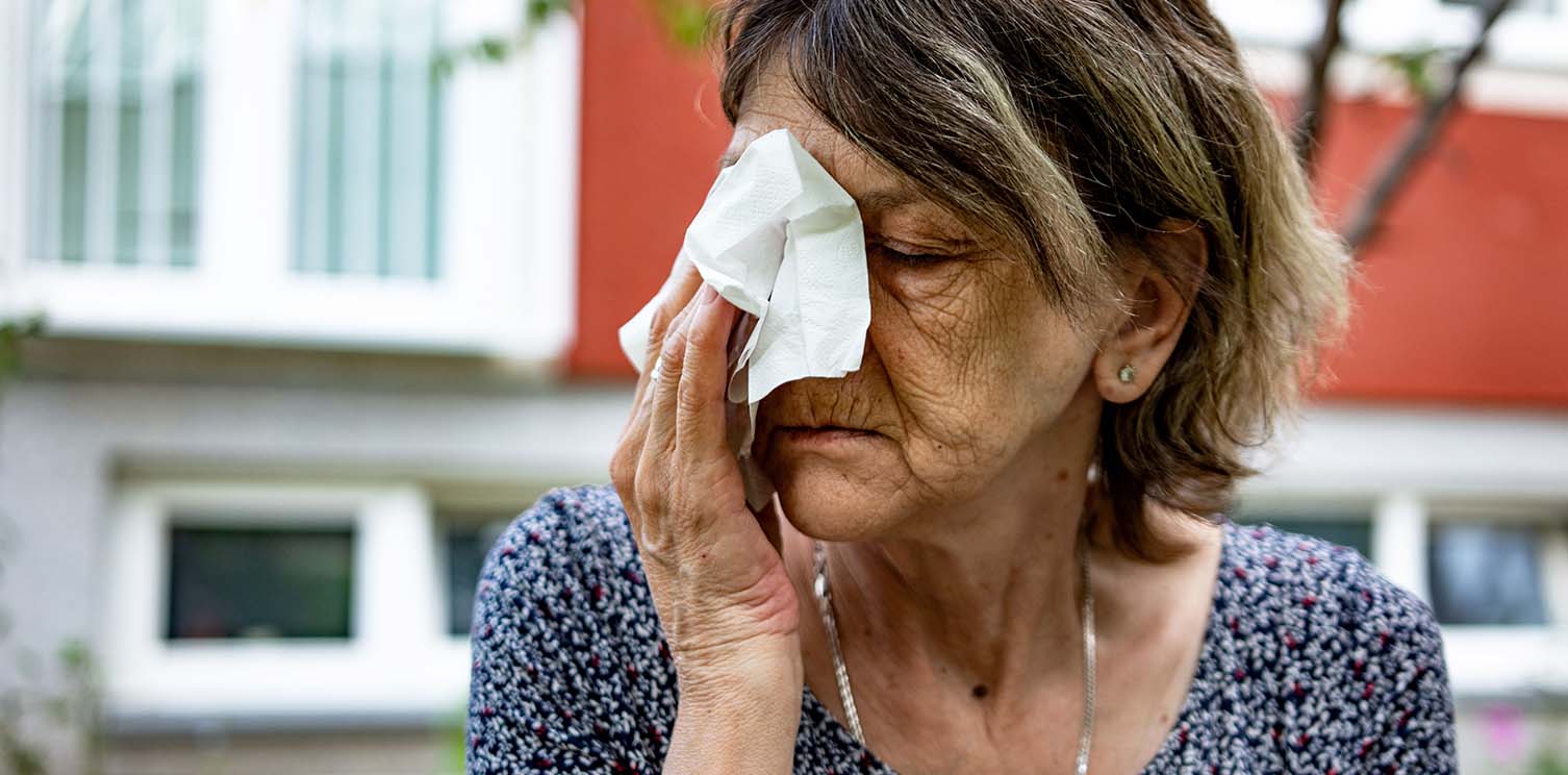 Woman with tissue on her nose