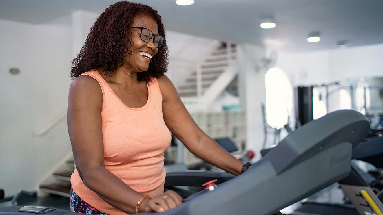 Older black lady on a treadmill